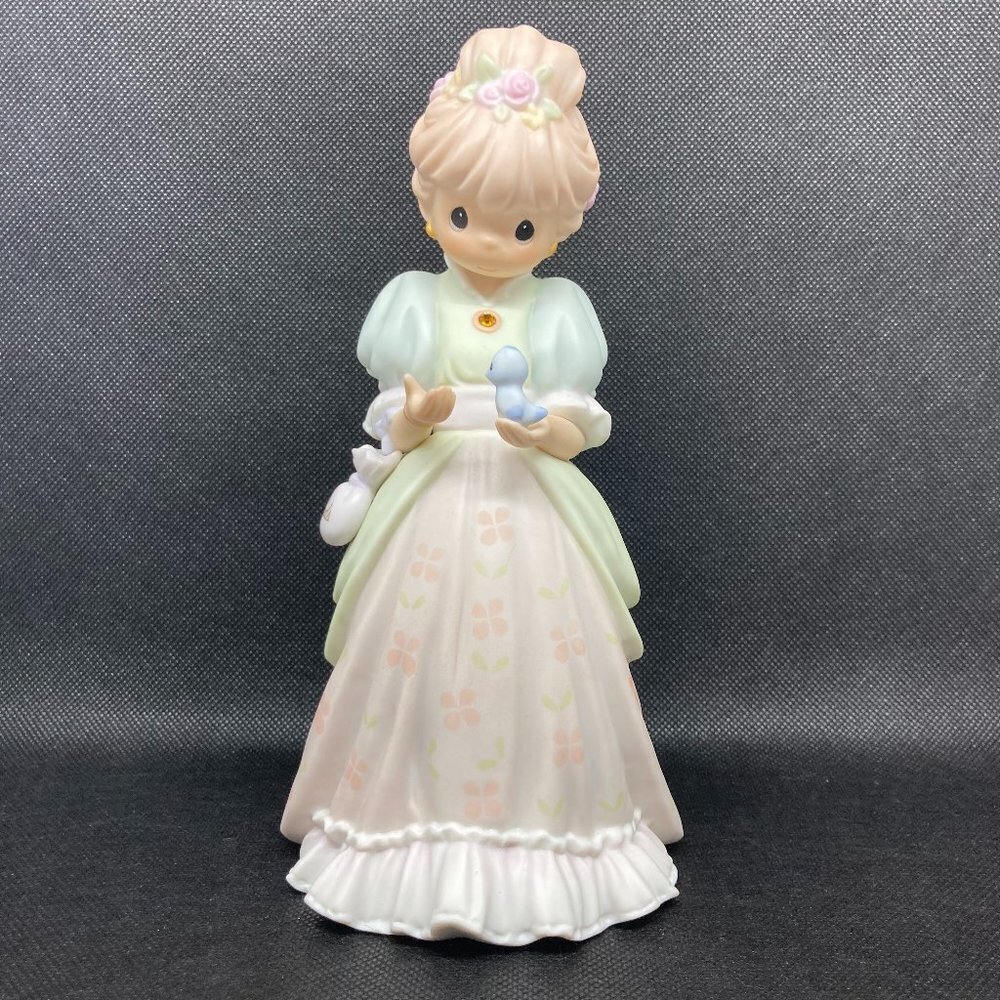 Precious Moments "Charity Begins In The Heart" figurine